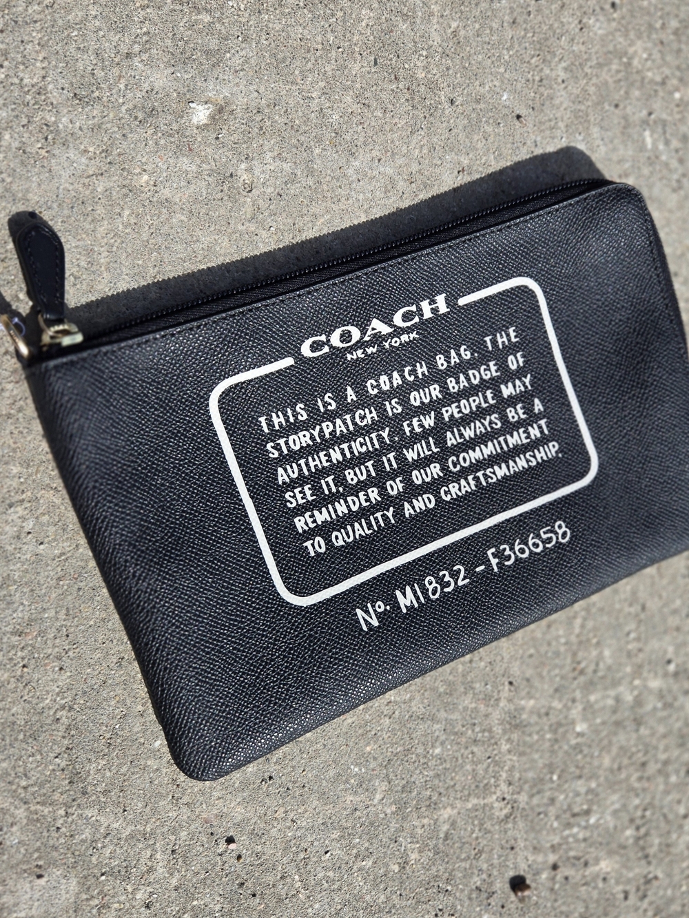 Coach Black Leather Zip Pouch with White Logo Text